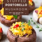 A close-up photo of a stuffed portobello mushroom on a wooden table.