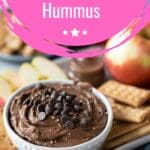 A close-up of a bowl of healthy chocolate hummus dip, topped with chocolate chips, ideal for a quick and delicious dessert.