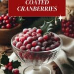 A glass bowl filled with sugar-coated cranberries on a white table cloth.
