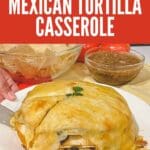 A close-up photo of a Mexican tortilla casserole on a white plate.