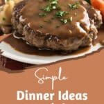A juicy Salisbury steak smothered in brown gravy, served with roasted vegetables on a bed of mashed potatoes.