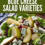 A close-up photo of a blue cheese salad with pears, pecans, and blue cheese crumbles.