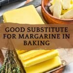 A bar of margarine sits on top of a cutting board.