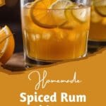 A homemade spiced rum sidecar cocktail in a coupe glass, garnished with lemon slices.