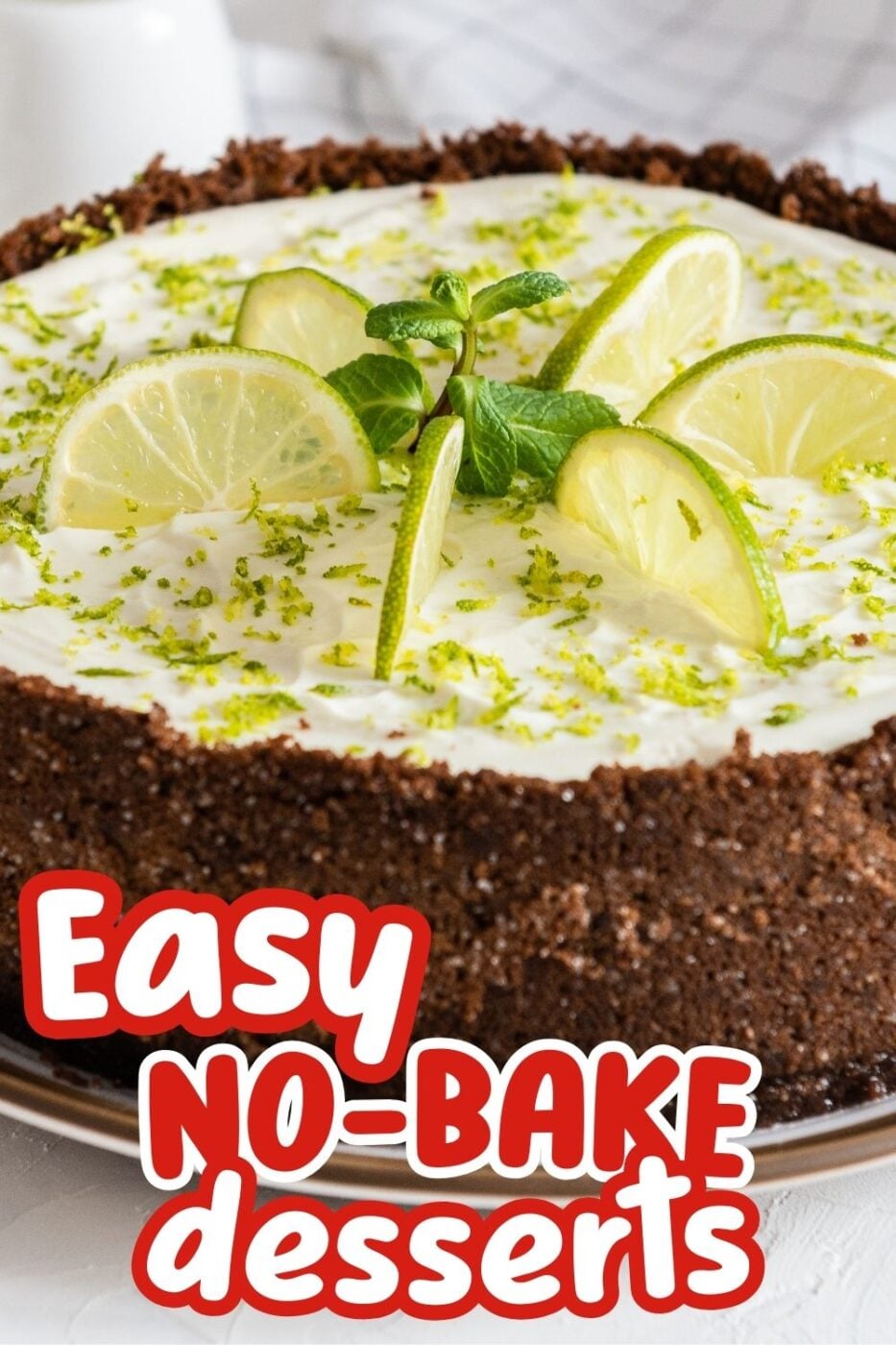 Picture of a whole no-bake lime cheesecake with ginger snap crust, decorated with slices of lime and lime zest with the words "Easy No Bake Desserts"