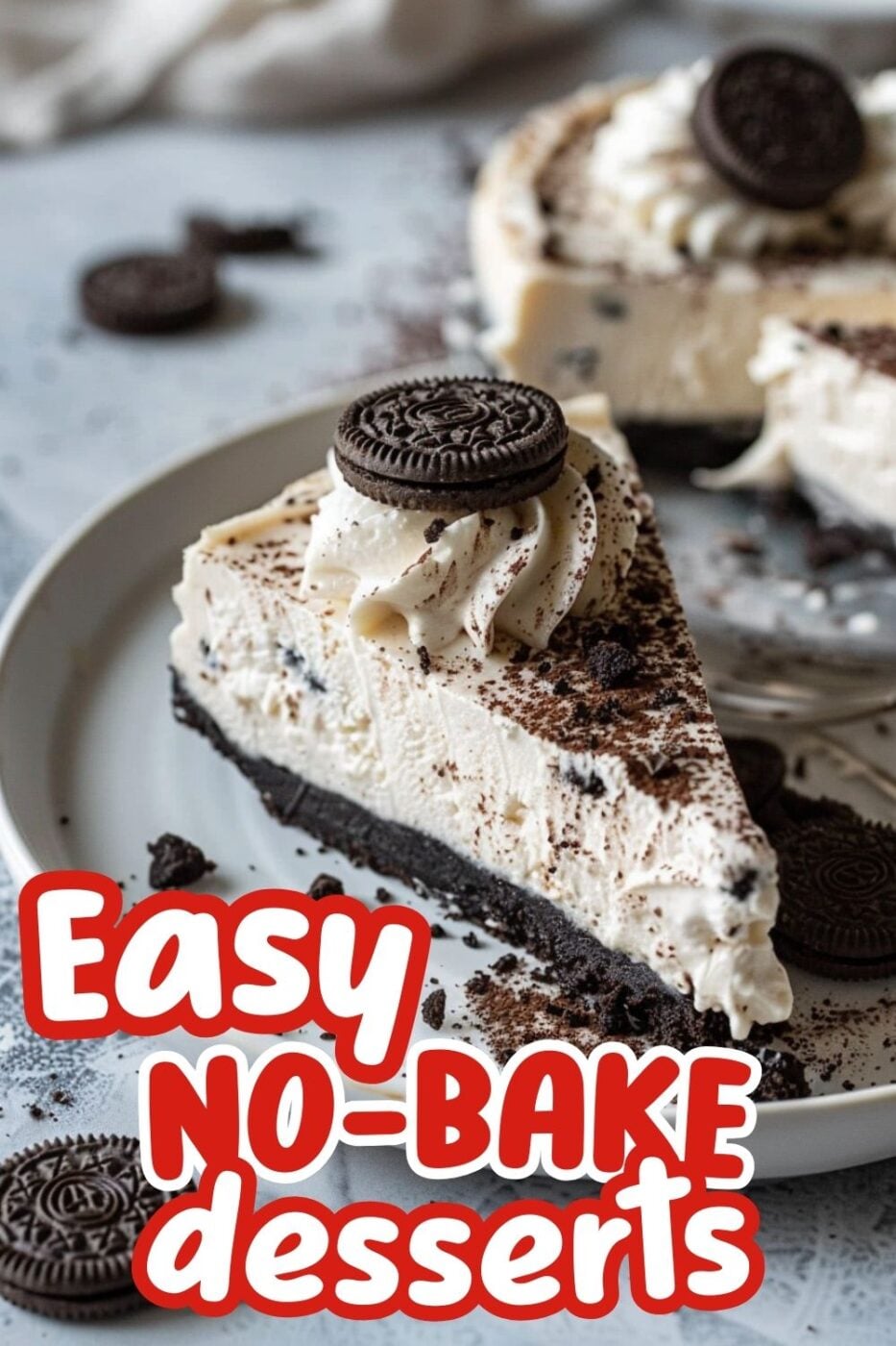 Slice of no bake OREO cheesecake dusted with crushed OREOs and topped with a mini OREO cookie. 