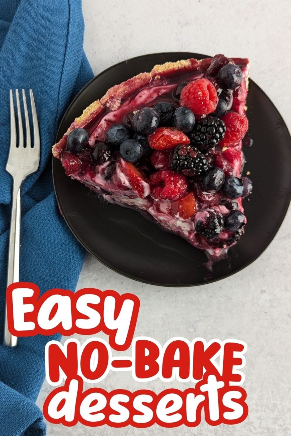 A no bake cheesecake filling swirled with cranberry puree, strawberry compote and fresh blueberries, blackberries and raspberries on a graham cracker crust