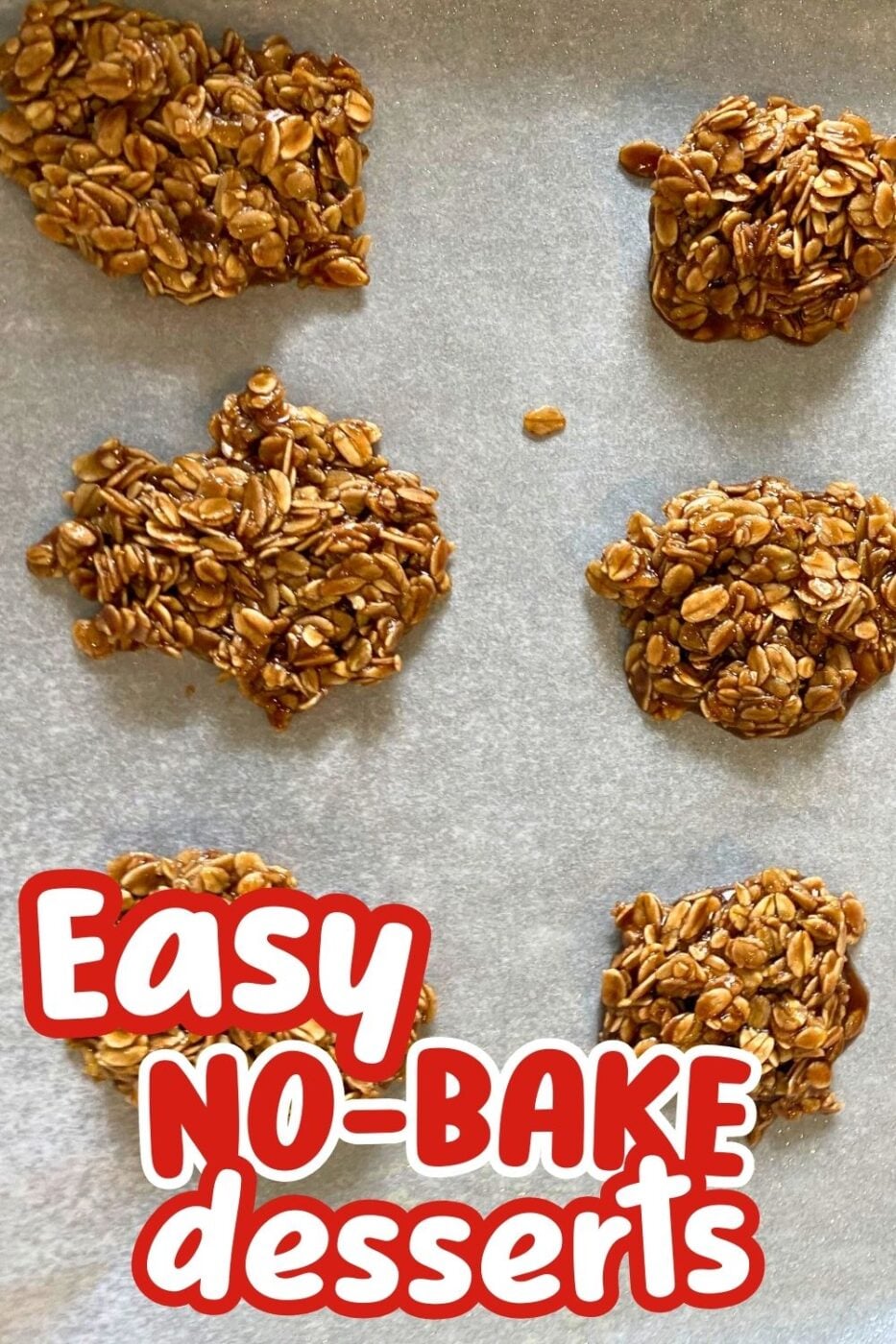 Top-down view of 6 classic no bake cookies made with oats on a piece of parchment paper