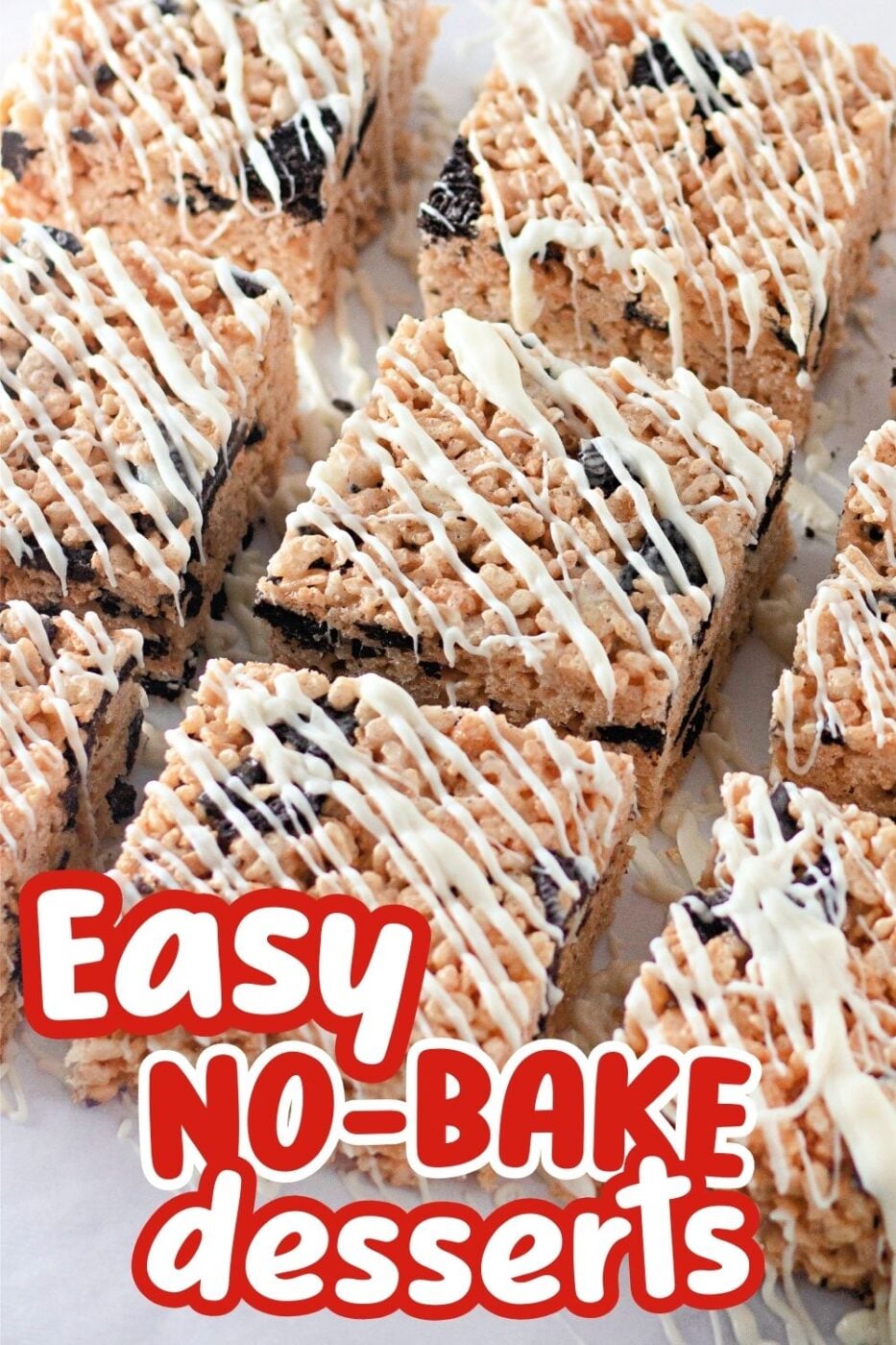 Squares of Rice Krispies Treats containing pieces of OREO cookies and drizzled with vanilla glaze