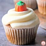 Pumpkin cupcakes with fluffy cream cheese frosting for fall treats.