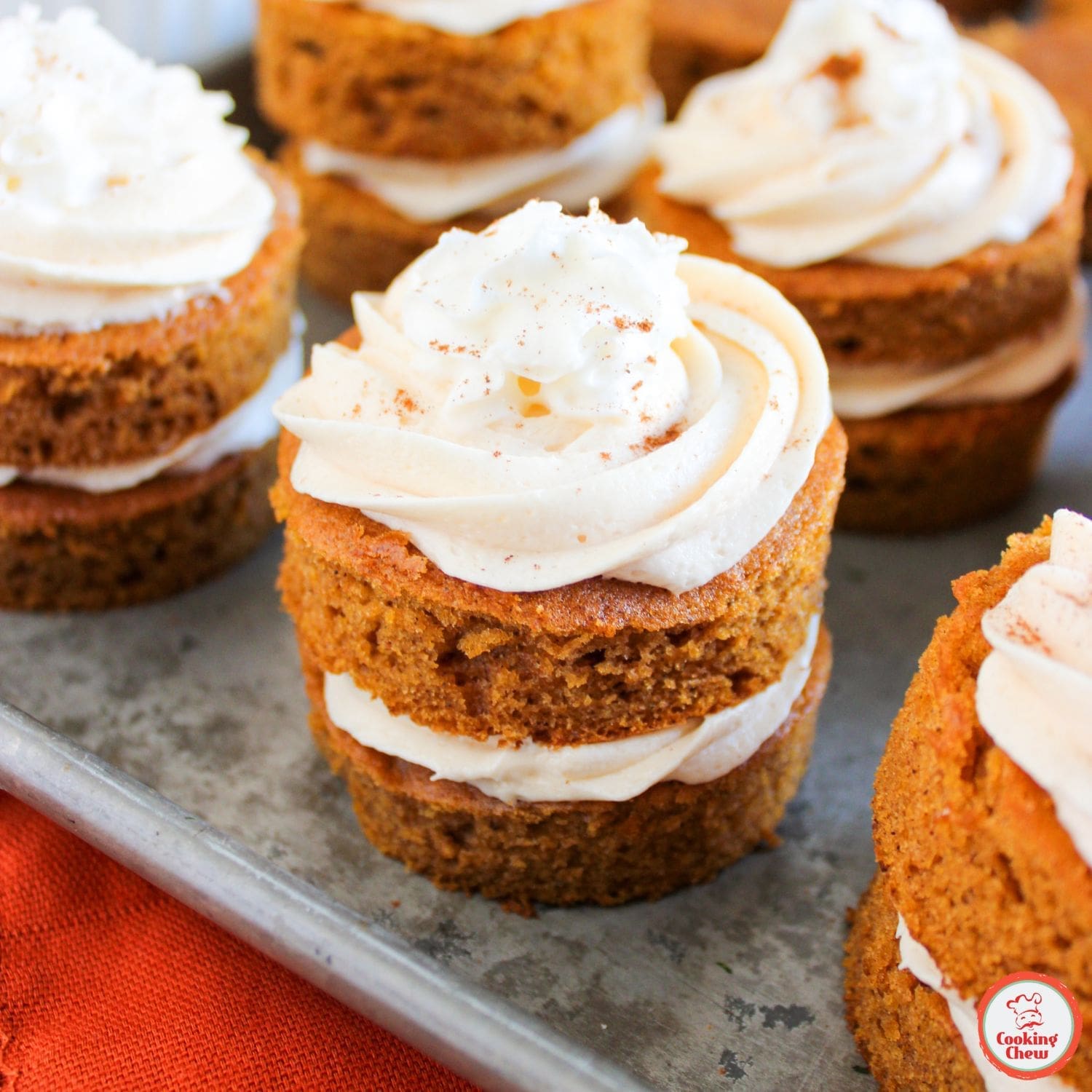 Mini cakes with pumpkin spice and caramel buttercream, a fall favorite.
