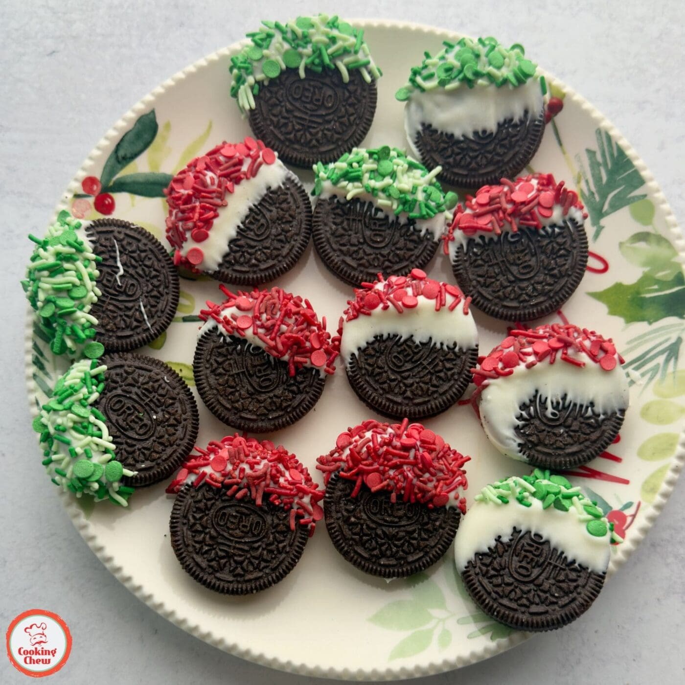White chocolate-covered Oreos with colorful Christmas decorations.