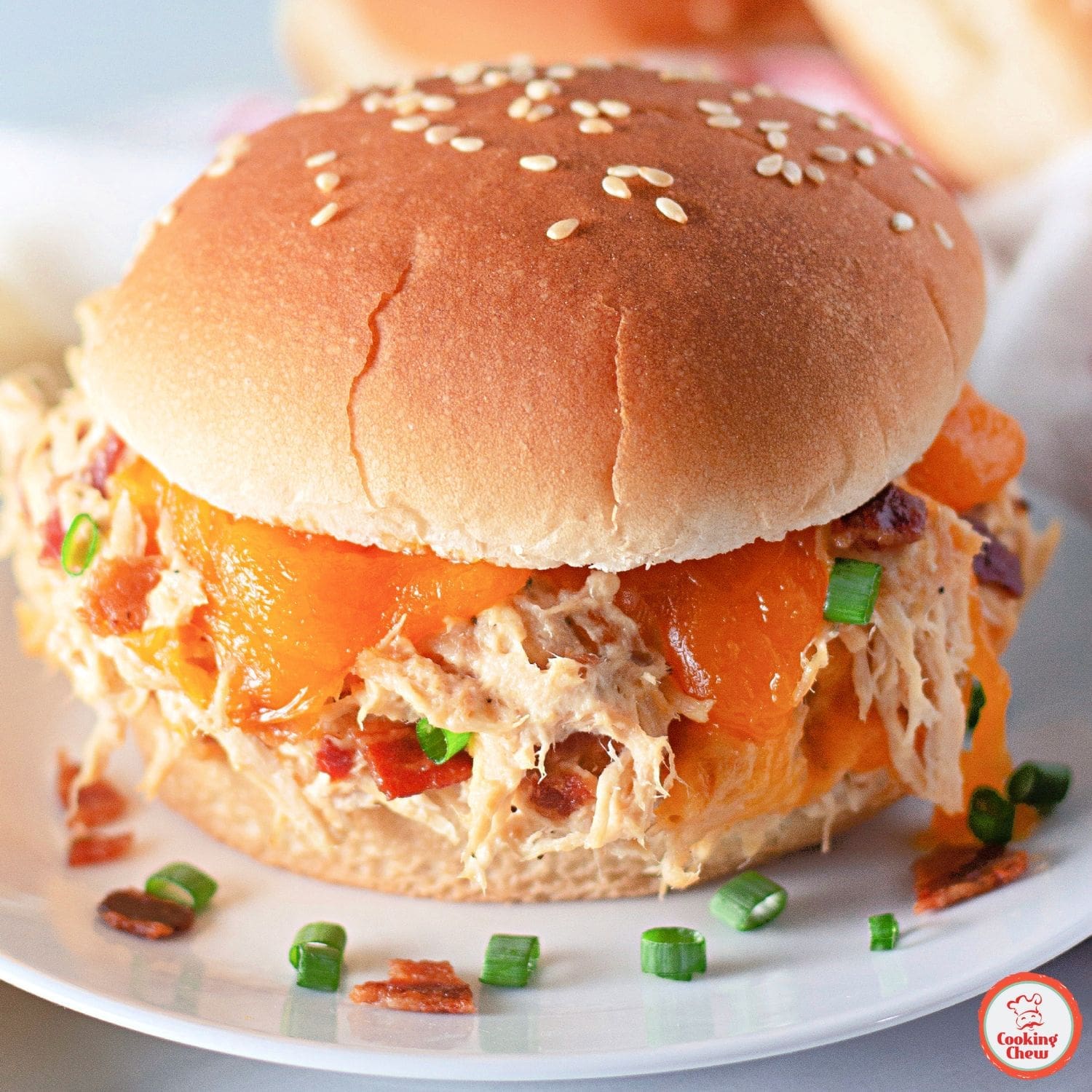 Bacon ranch crack chicken topped with fresh parsley.