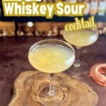 A beautifully crafted Whiskey Sour made with bourbon and fresh lime juice, garnished with a lime wedge.