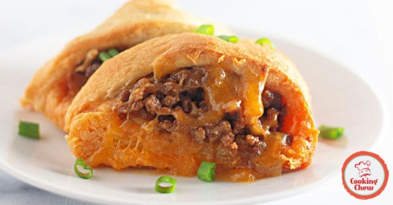 Family-sized taco crescent ring on a platter, garnished with fresh toppings.