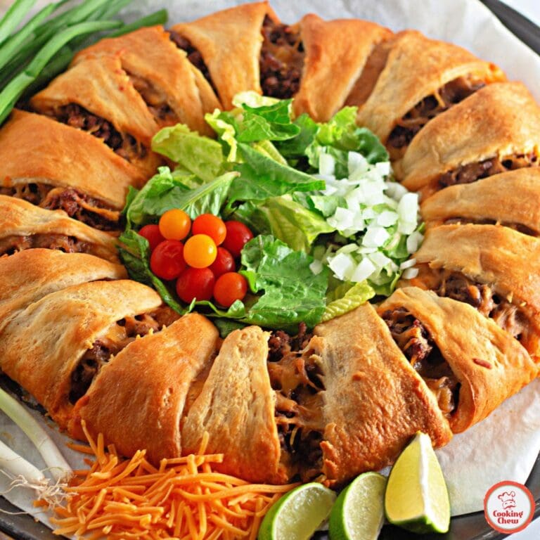 A close-up of taco crescent rolls with fresh salsa on the side.