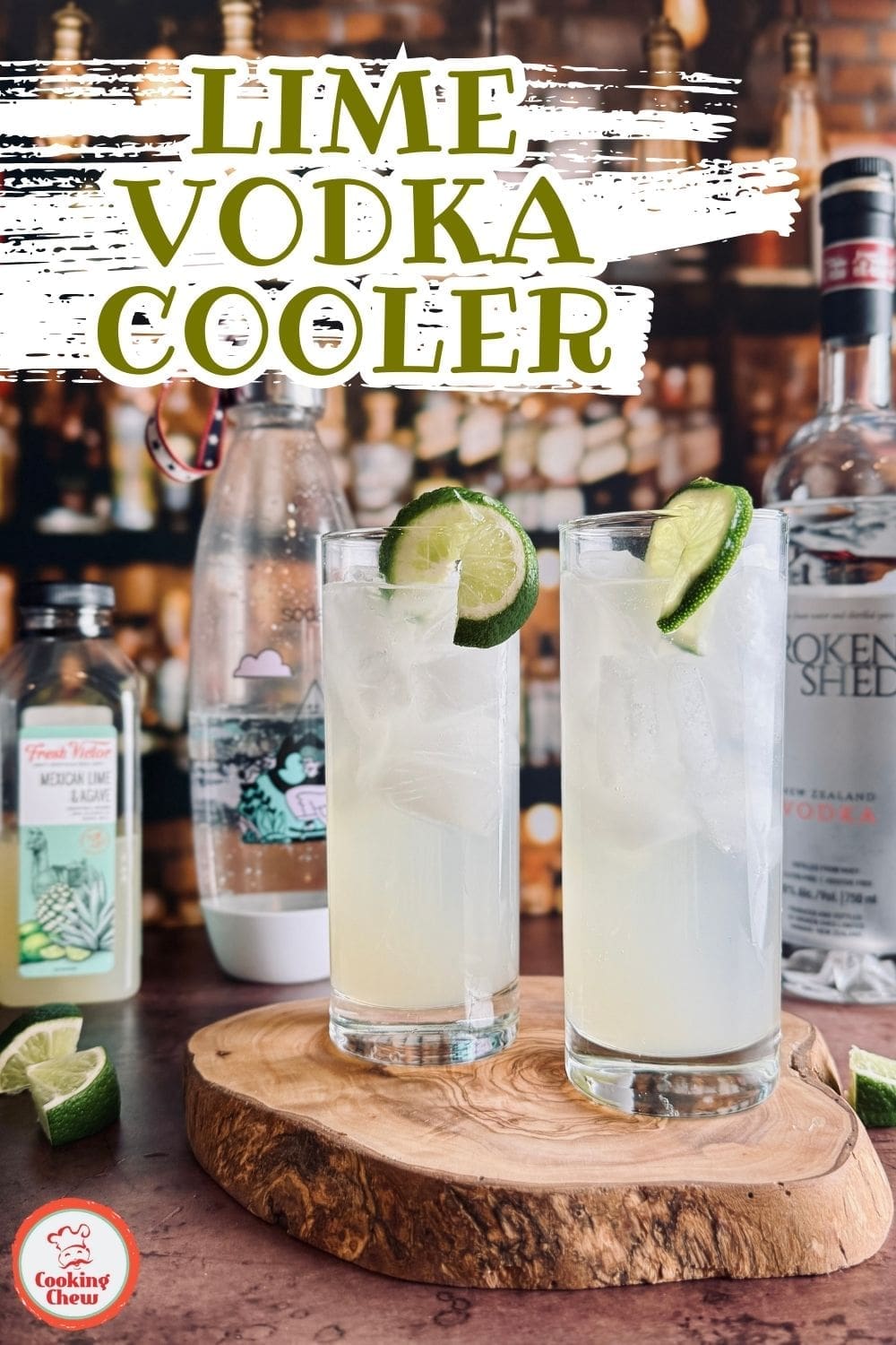 A close-up of a fizzy lime vodka cocktail in a glass, garnished with lime slices.