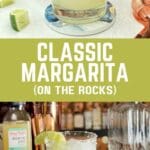 A glass of margarita on the rocks with a lime wedge and salted rim, placed on a wooden table.