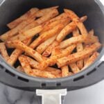 Crispy French fries prepared using an air fryer.​