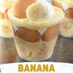 Mini banana pudding cups layered with whipped cream and bananas.