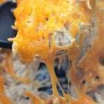 Creamy and cheesy crack chicken topped with crispy bacon and ranch, served hot in a skillet for an easy one-pot dinner