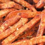 Golden, crispy air fryer seasoned French fries on a plate, served fresh and flavorful, showcasing the golden-brown texture and perfect seasoning.
