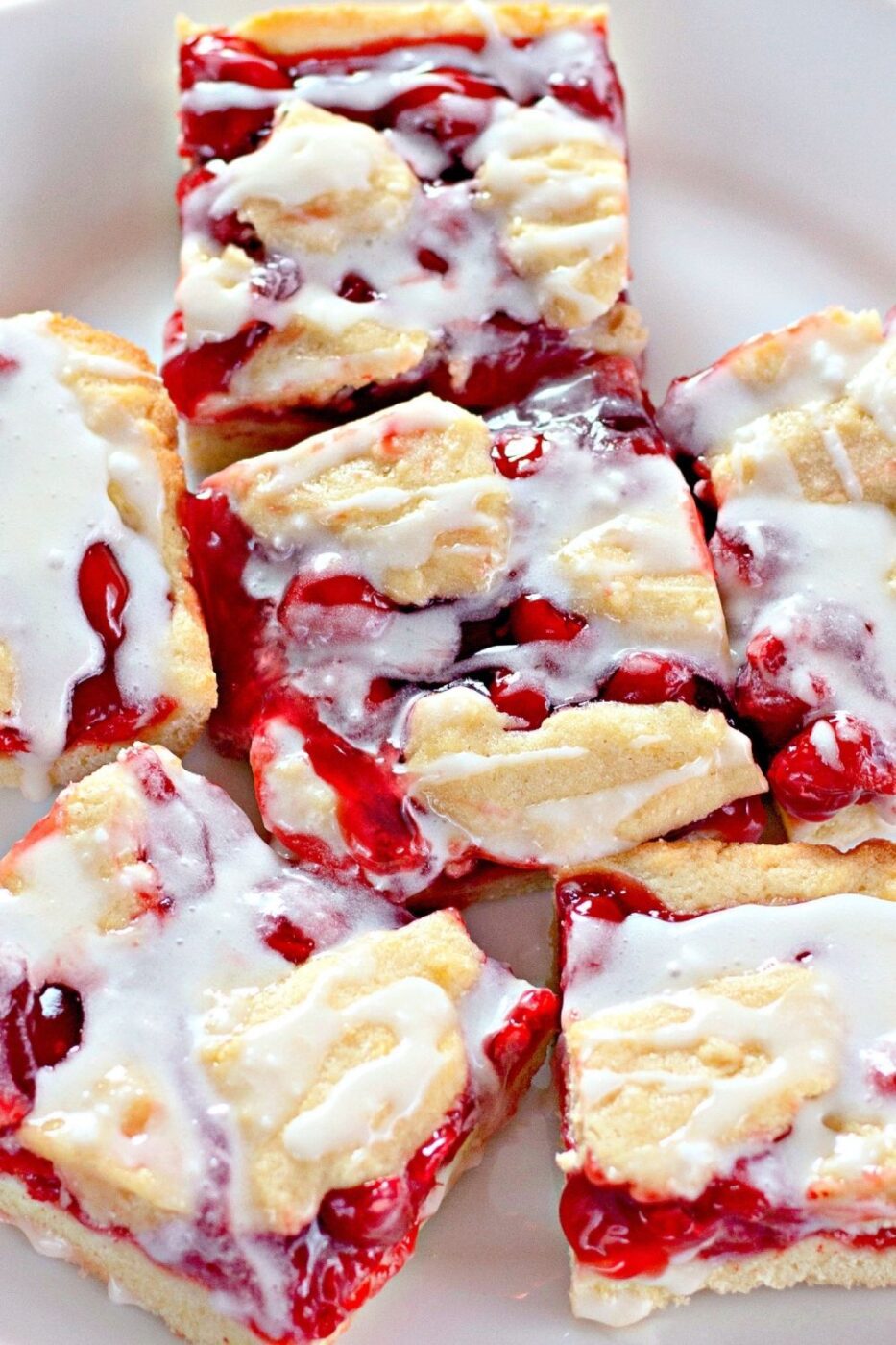 Cherry dessert squares on a cooling rack.