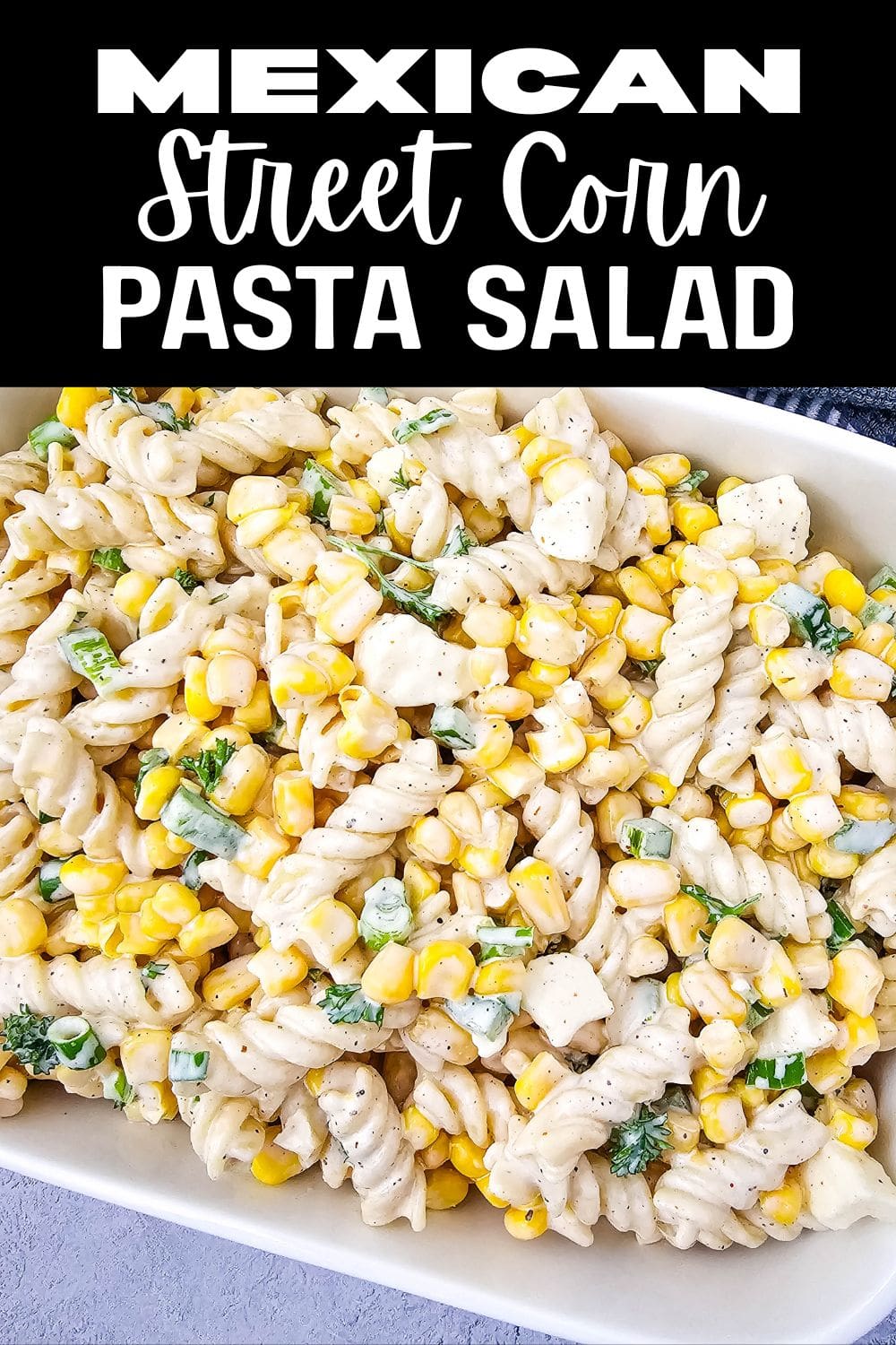 A vibrant bowl of Mexican street corn pasta salad with corn, pasta, and cilantro.