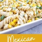 A close-up of elote pasta salad, highlighting the creamy dressing and charred corn.