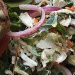 A bowl of fresh, vibrant no-mayo Carolina coleslaw with shredded cabbage and carrots.