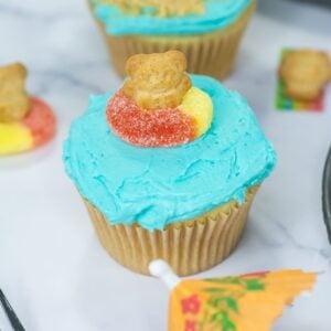 A clear, detailed image of an individual beach-themed cupcake.
