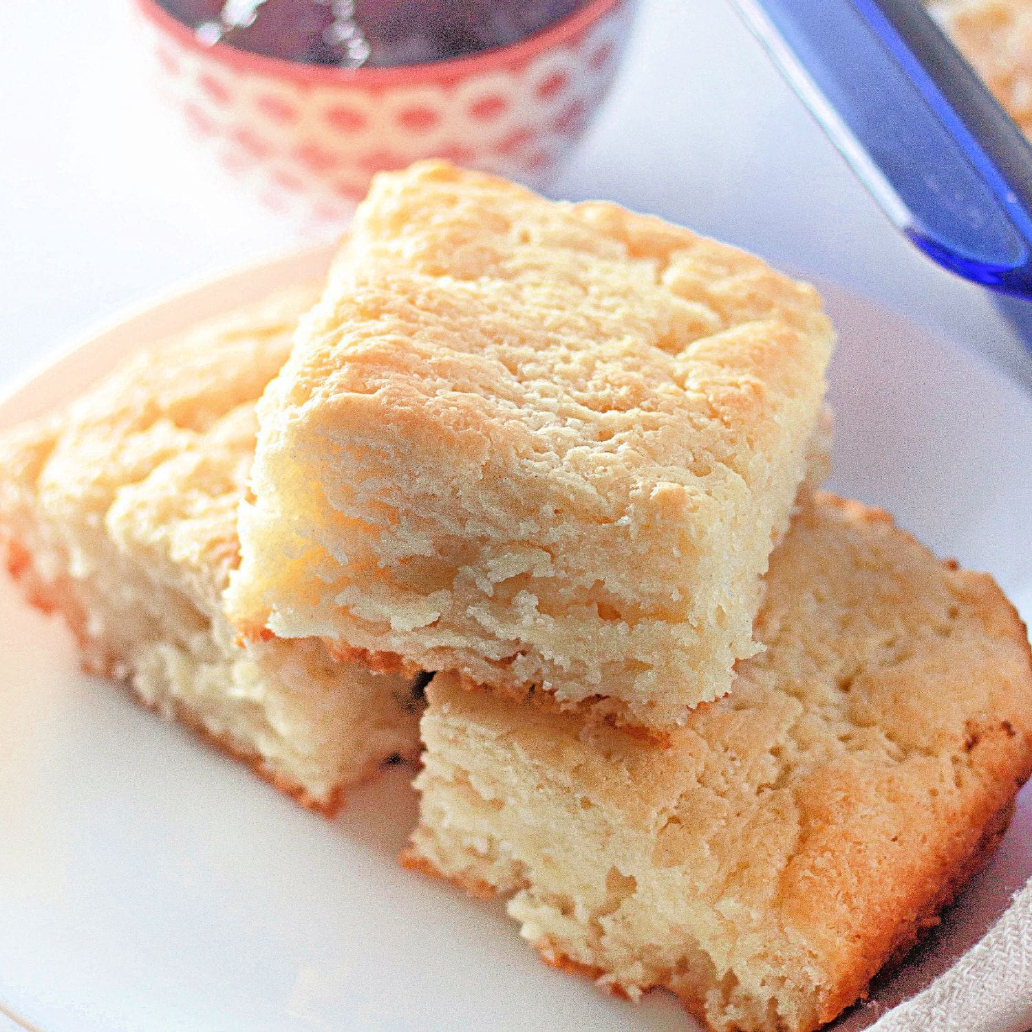 A wide, inviting shot of a full pan of golden-brown butter dip biscuits.