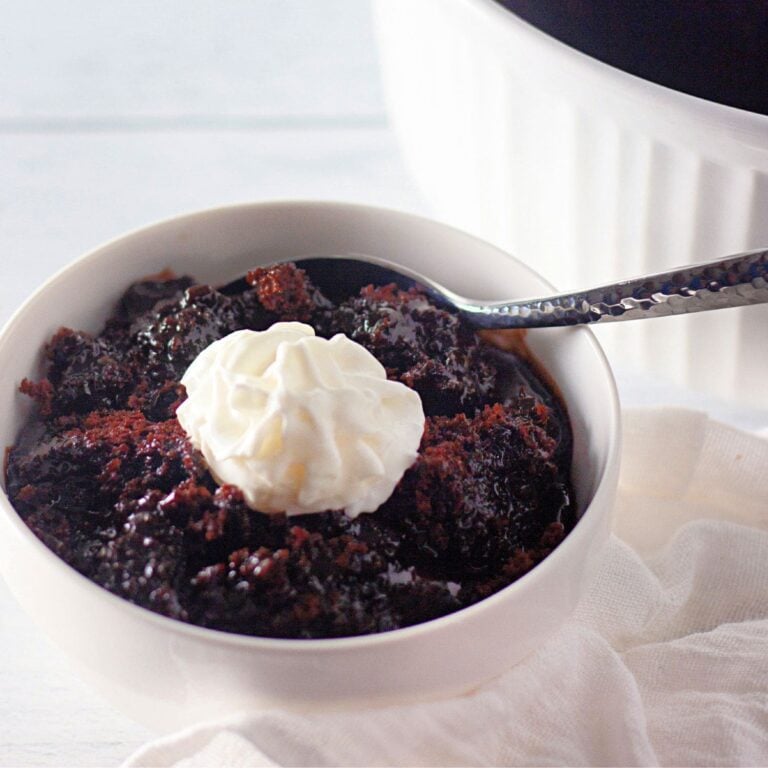 A large, inviting photo of a rich chocolate lava cake with a gooey center, possibly topped with ice cream.