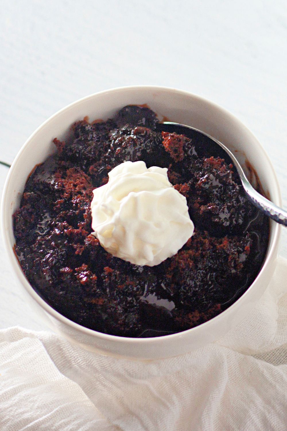 A spoonful of molten chocolate center from a lava cake.
