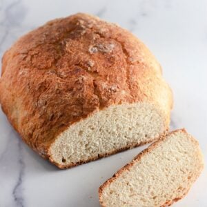 A clear, detailed image of a slice of rustic bread, showing its texture.