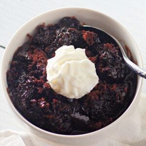A clear, detailed image of a microwave chocolate lava cake in a mug, suitable for a recipe card.