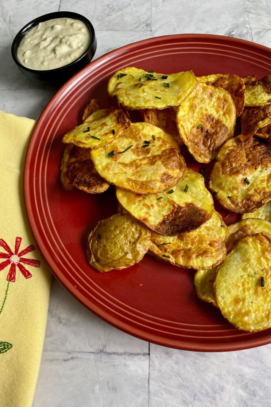 A plate of golden, crispy air fryer potato chips.