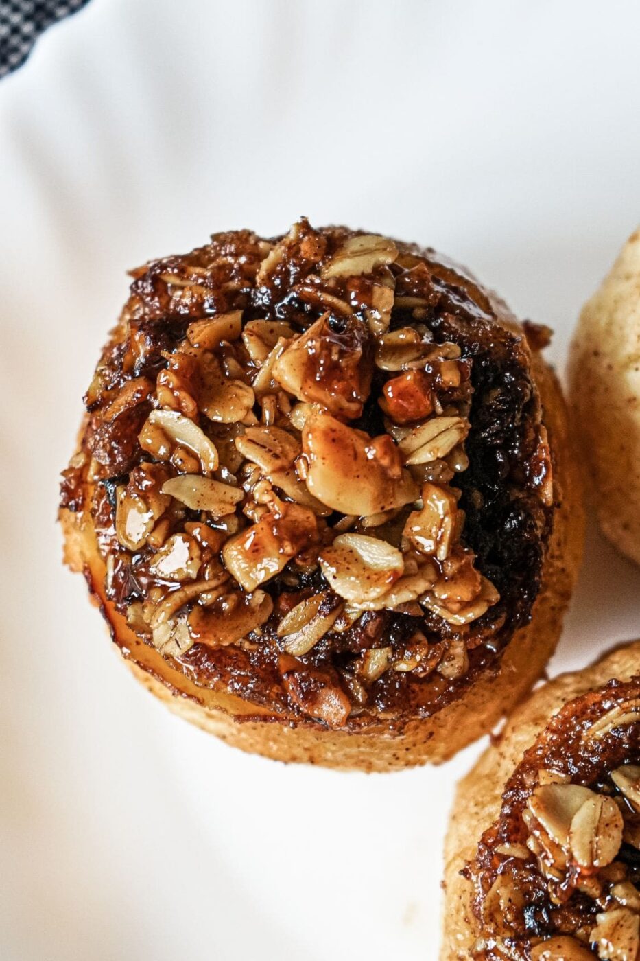 Baked apples stuffed with oat crumble and drizzled with maple syrup.