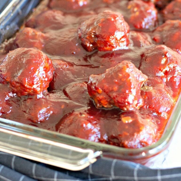Featured image of cranberry BBQ meatballs with parsley garnish.
