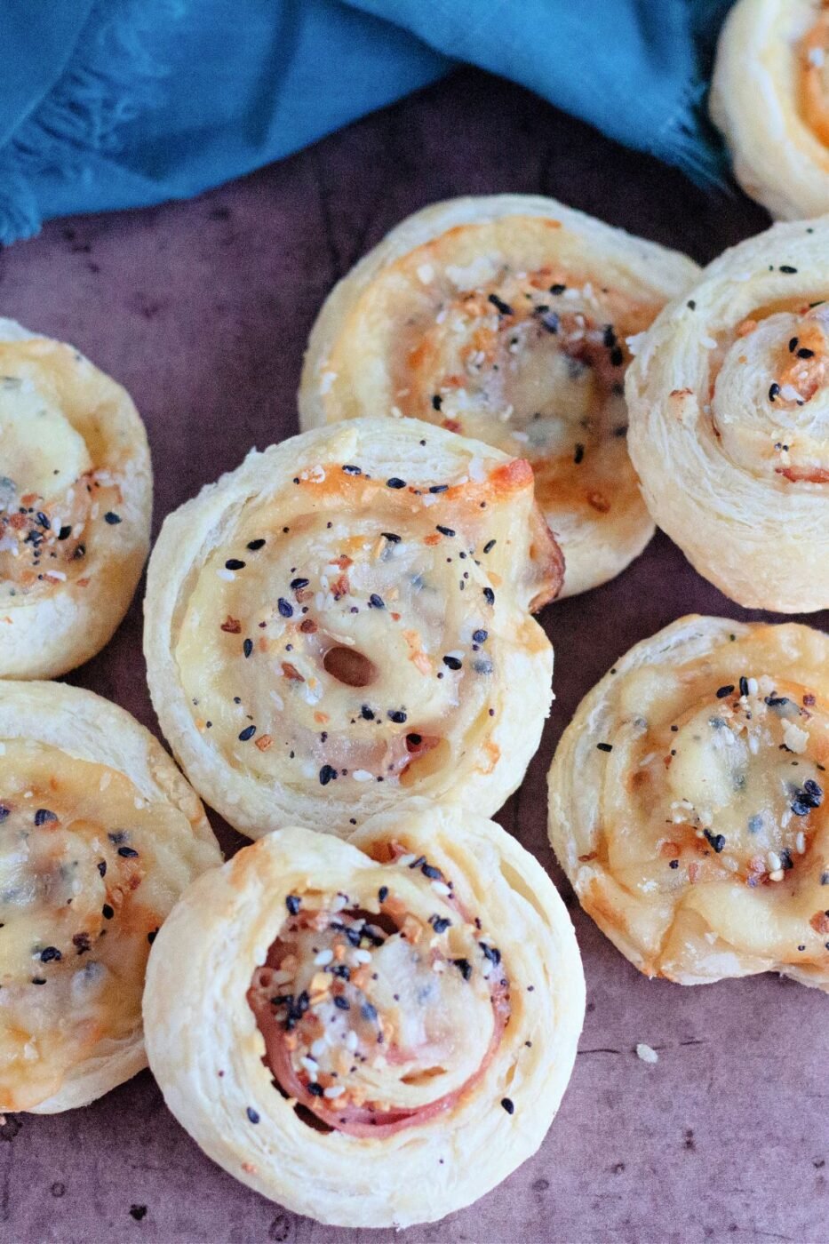 Puff pastry pinwheels filled with ham and melted cheese.