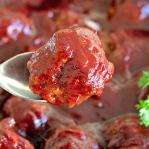 Close-up recipe card image of cranberry-glazed meatballs.