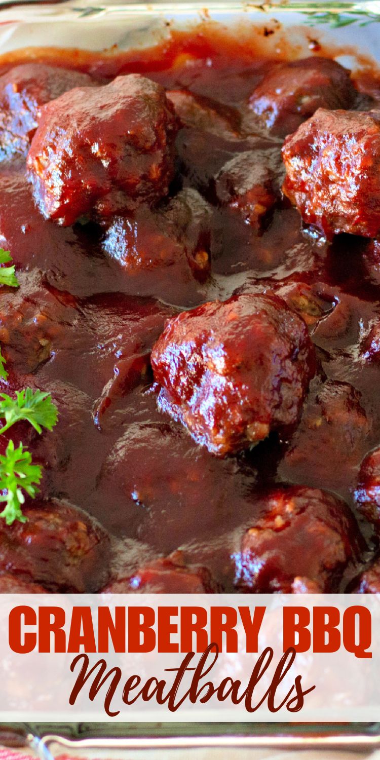 Close-up of glazed cranberry BBQ meatballs in rich sauce.