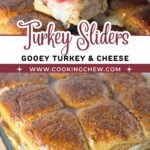 A tray of gooey turkey cranberry sliders with melted cheese and golden poppy seed glaze.