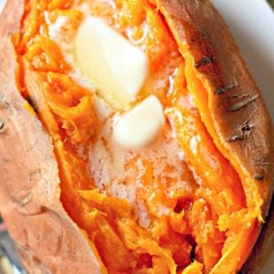 Cut open steamed sweet potato cooked in the Instant Pot with butter and brown sugar