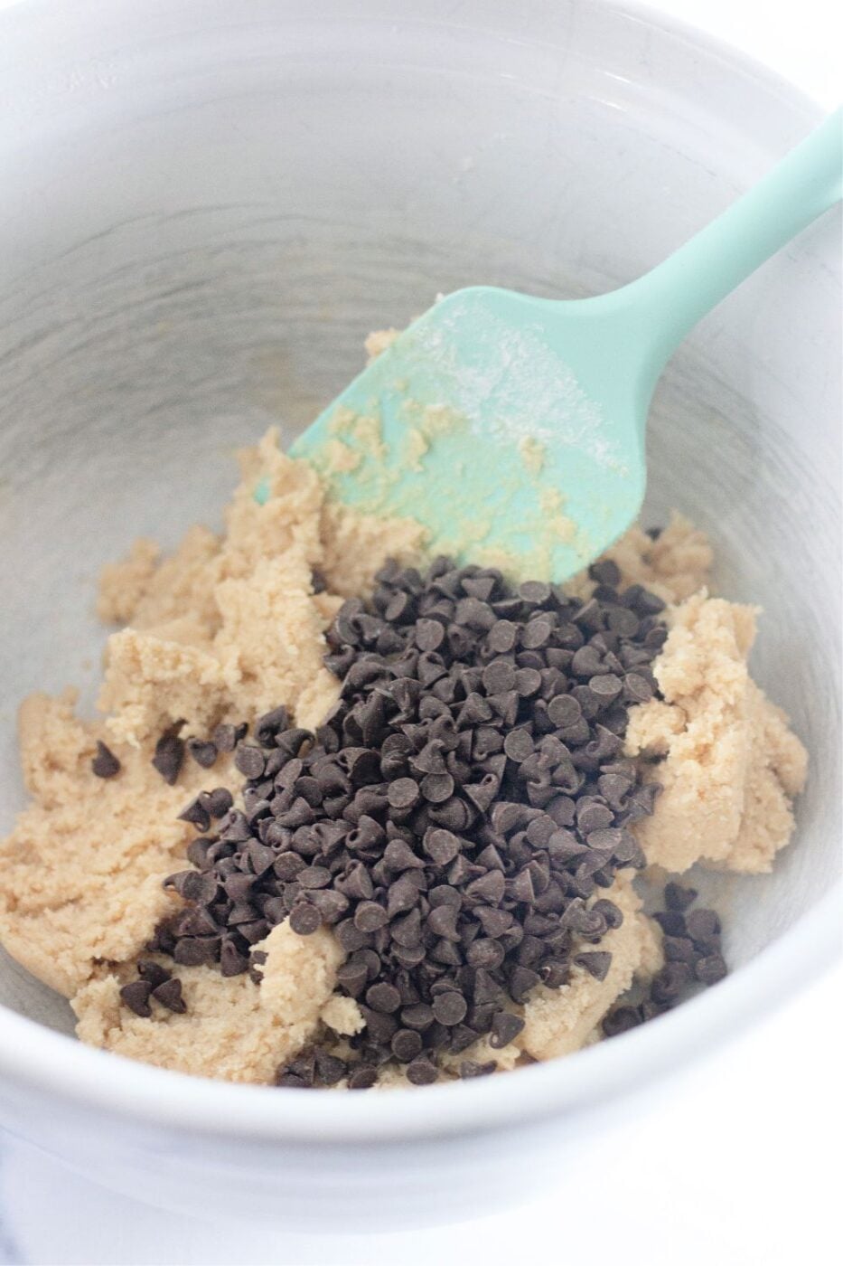 Finished edible chocolate chip cookie dough in a serving bowl.