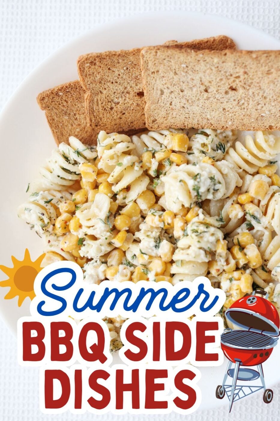 A large bowl of creamy pasta salad with colorful vegetables and dressing.