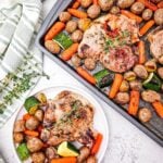 Overhead view of sheet pan honey glazed pork chops with roasted vegetables and plated serving on white plate