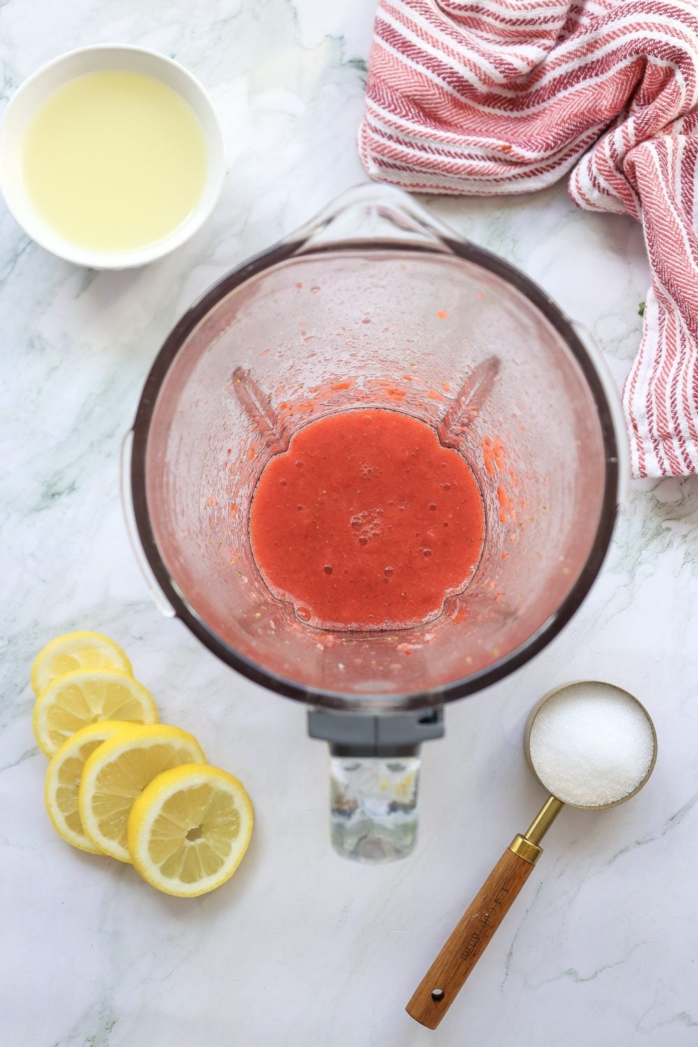 Strawberry puree in a blender during step 1 of making 4th of July strawberry lemonade
