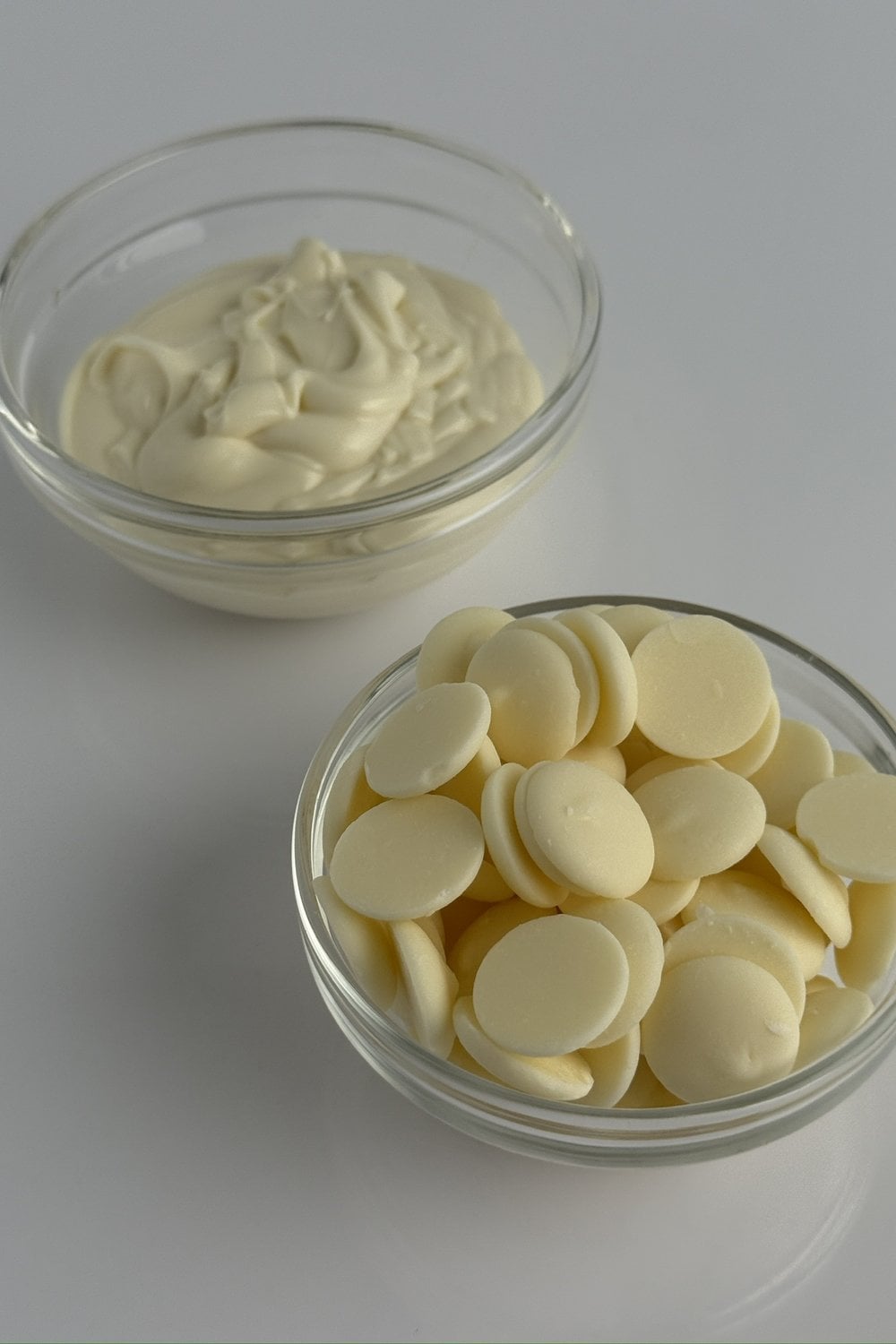 White chocolate melting wafers in glass bowl ready to melt