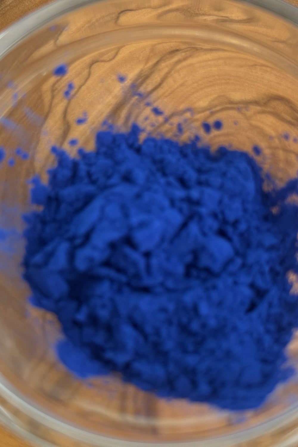 Blue spirulina powder in a glass bowl, the natural blue pigment for Method 2